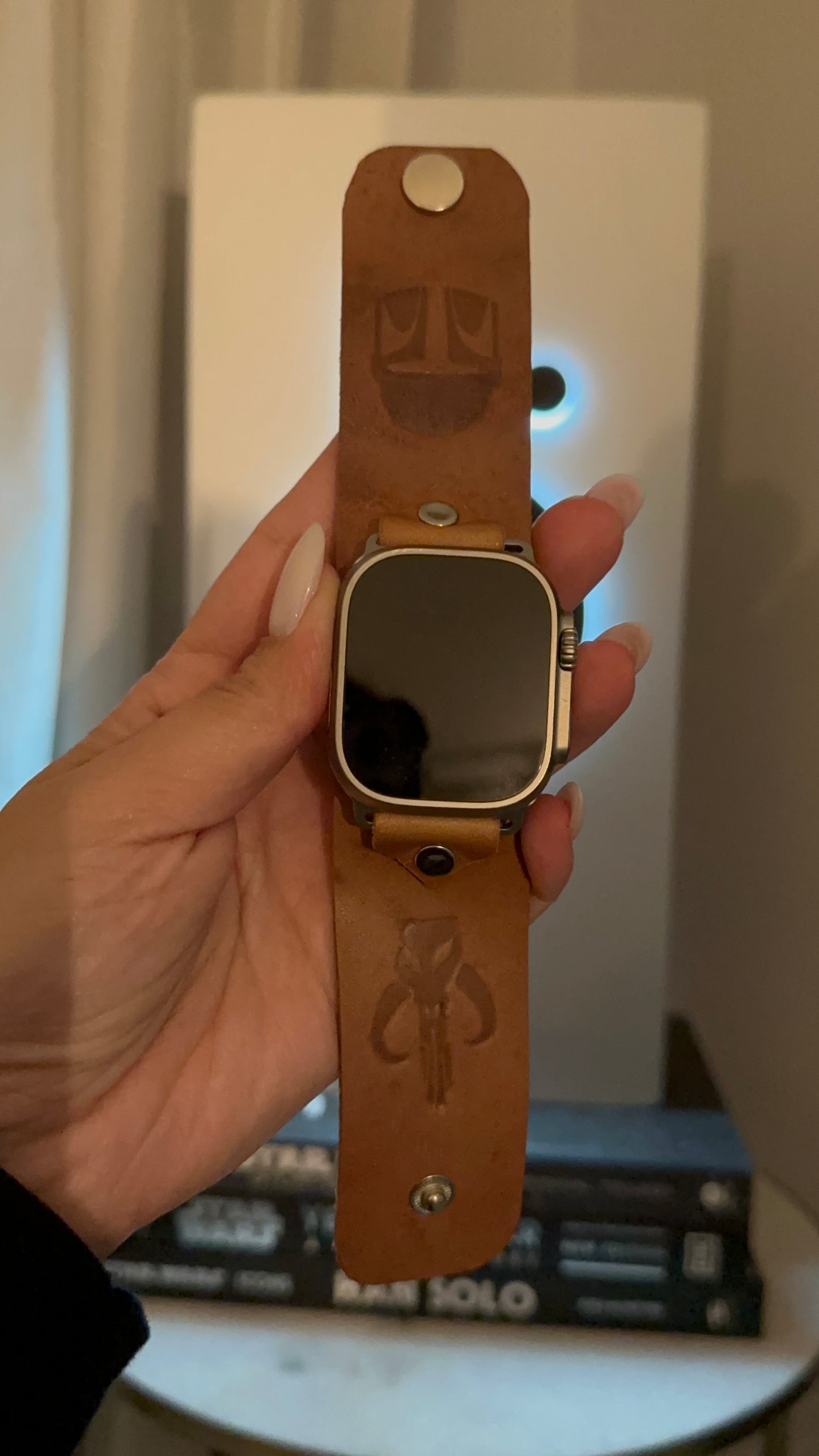 This is a Vachetta leather band that is embossed with your choice of galactic symbols. This leather will patina into a caramel color overtime. The size of the band is approximately 1.5 inches wide. The adapters are held with studs or crystals in silver, gunmetal, gold, or antique gold finishes.