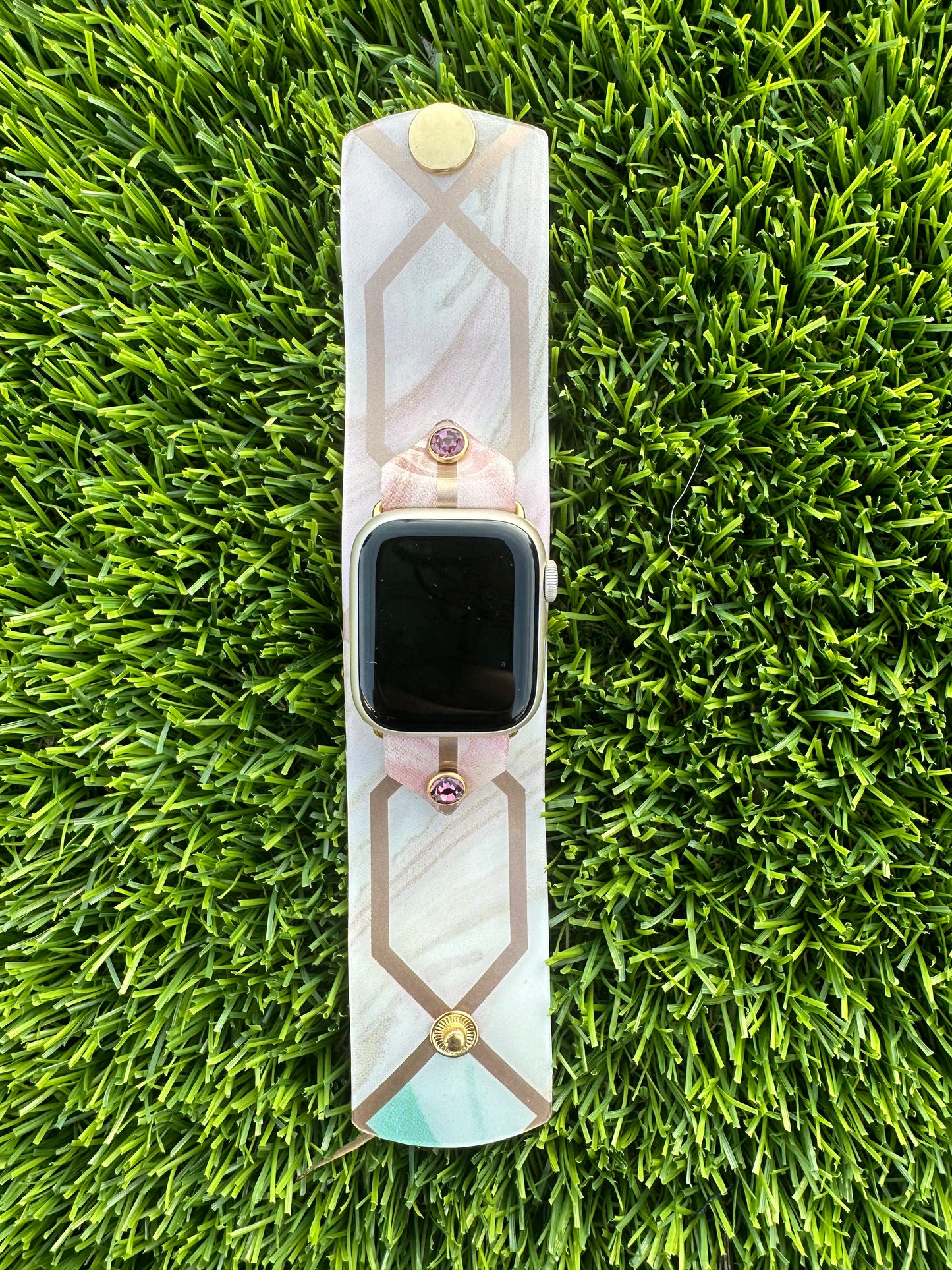 The Stained Glass band is made from an upcycled waterproof material. This band is paired with a gold rimmed crystal that will match the colors on each band.
