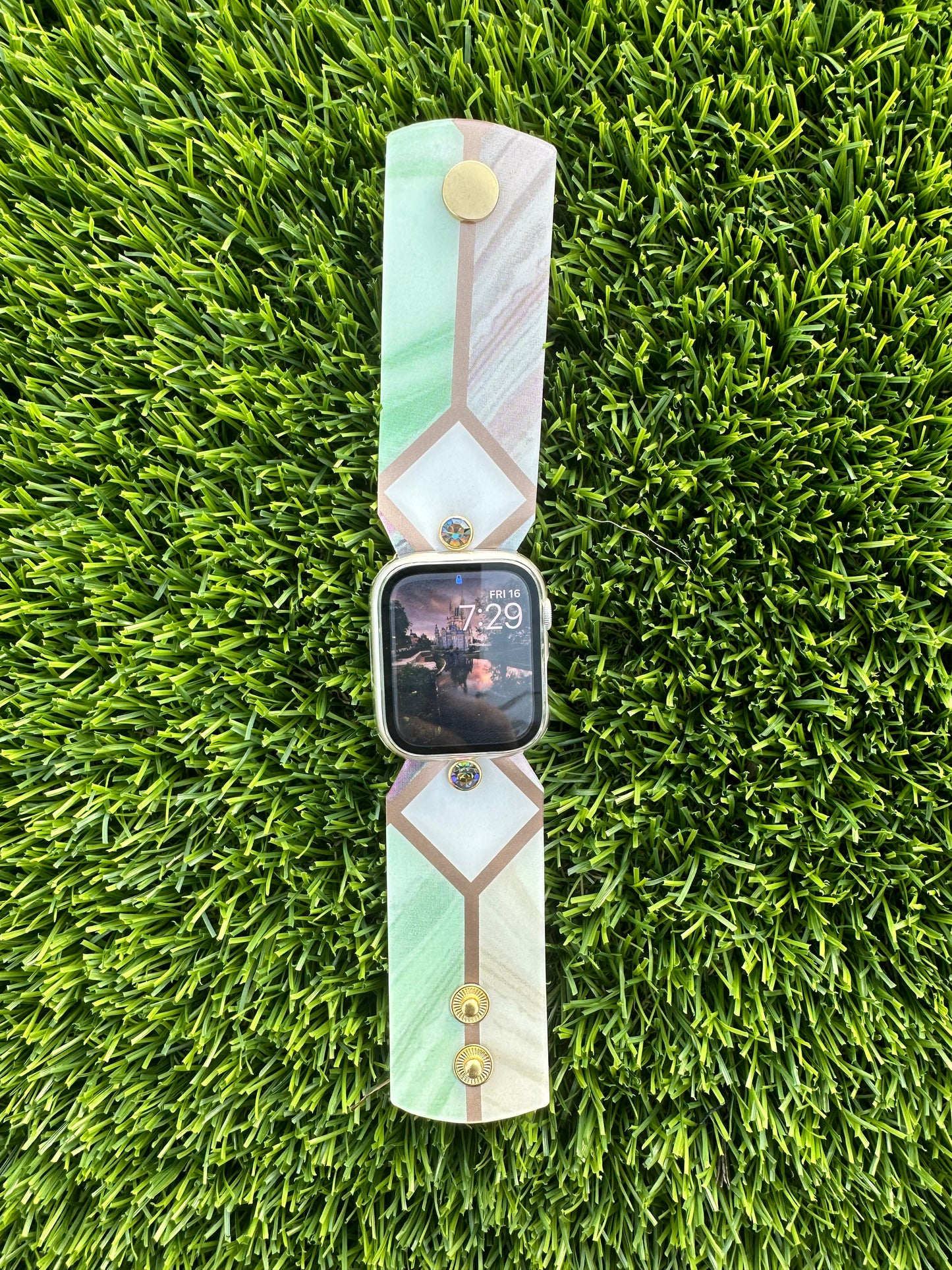 The Stained Glass band is made from an upcycled waterproof material. This band is paired with a gold rimmed crystal that will match the colors on each band.