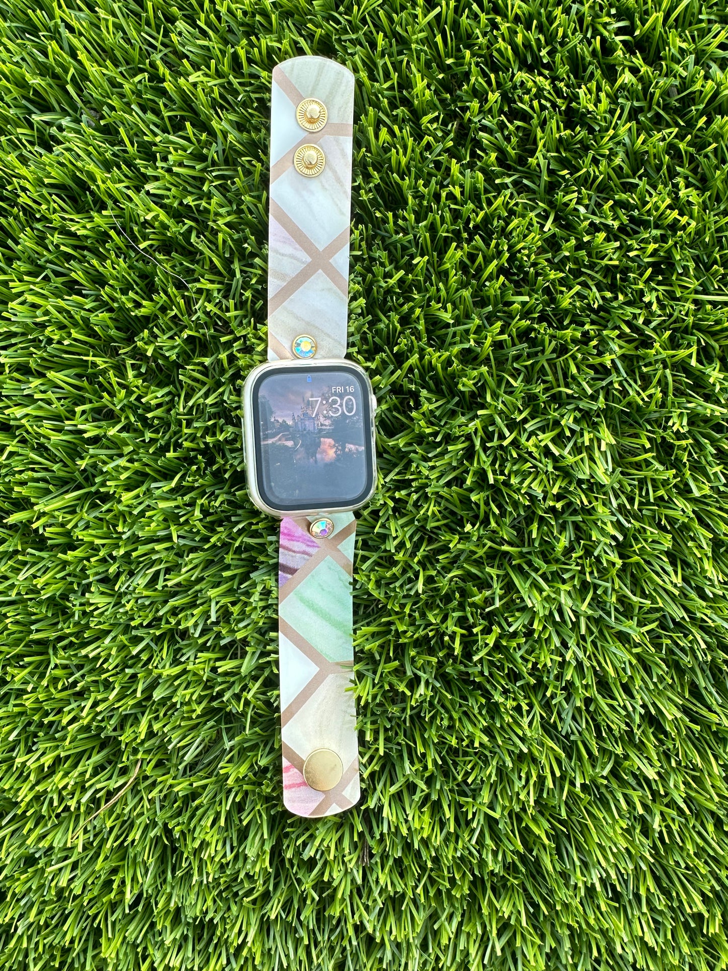 The Stained Glass band is made from an upcycled waterproof material. This band is paired with a gold rimmed crystal that will match the colors on each band.