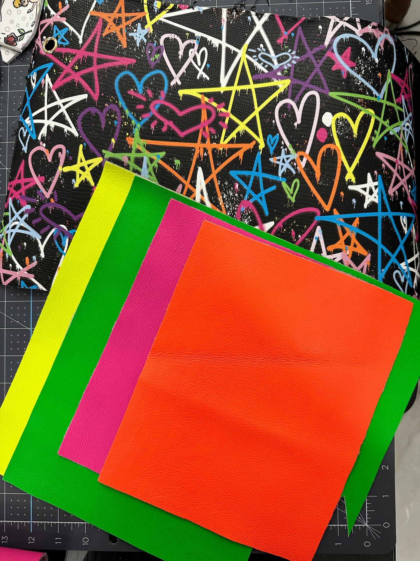 This is an authentic Besty Johnson band. It is made out of a faux leather material and lined with your choice of neon leather.