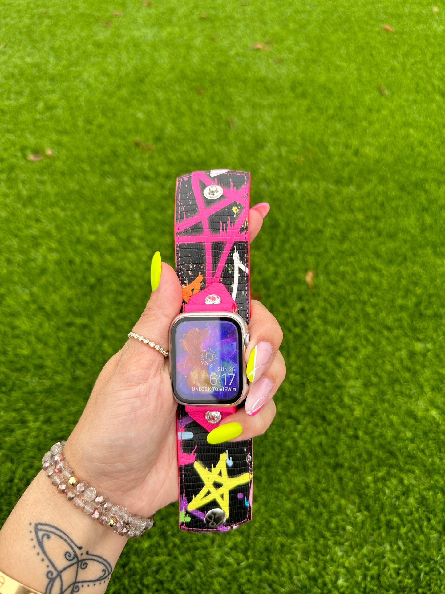 This is an authentic Besty Johnson band. It is made out of a faux leather material and lined with your choice of neon leather.
