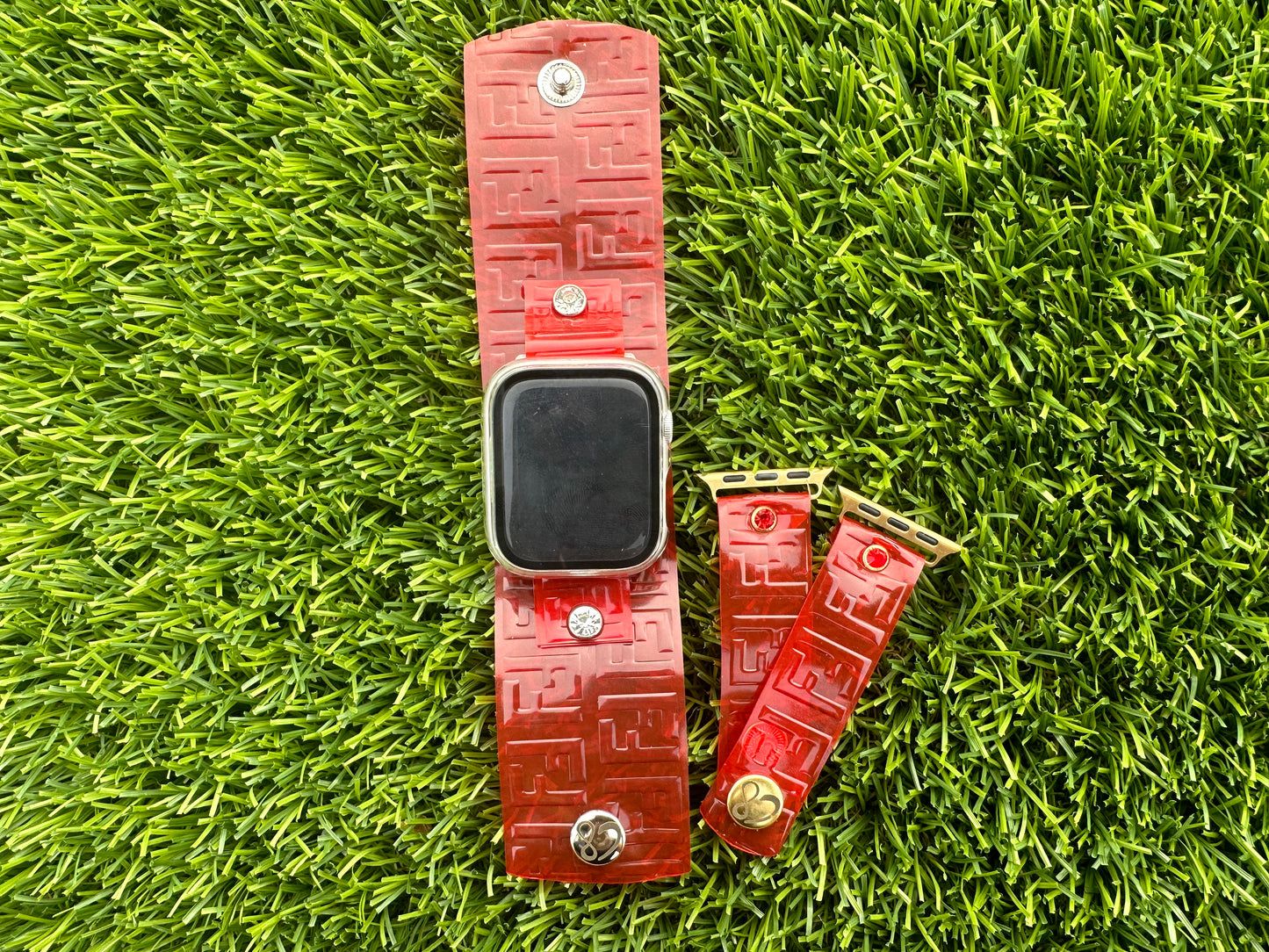 This is an authentic upcycled Red Fendi bag. It is a waterproof band made out of a red color plastic. It is paired with either silver or yellow gold rimmed crystals and matching hardware. Pair it with the color crystal of your choice. Available in all of our styles.