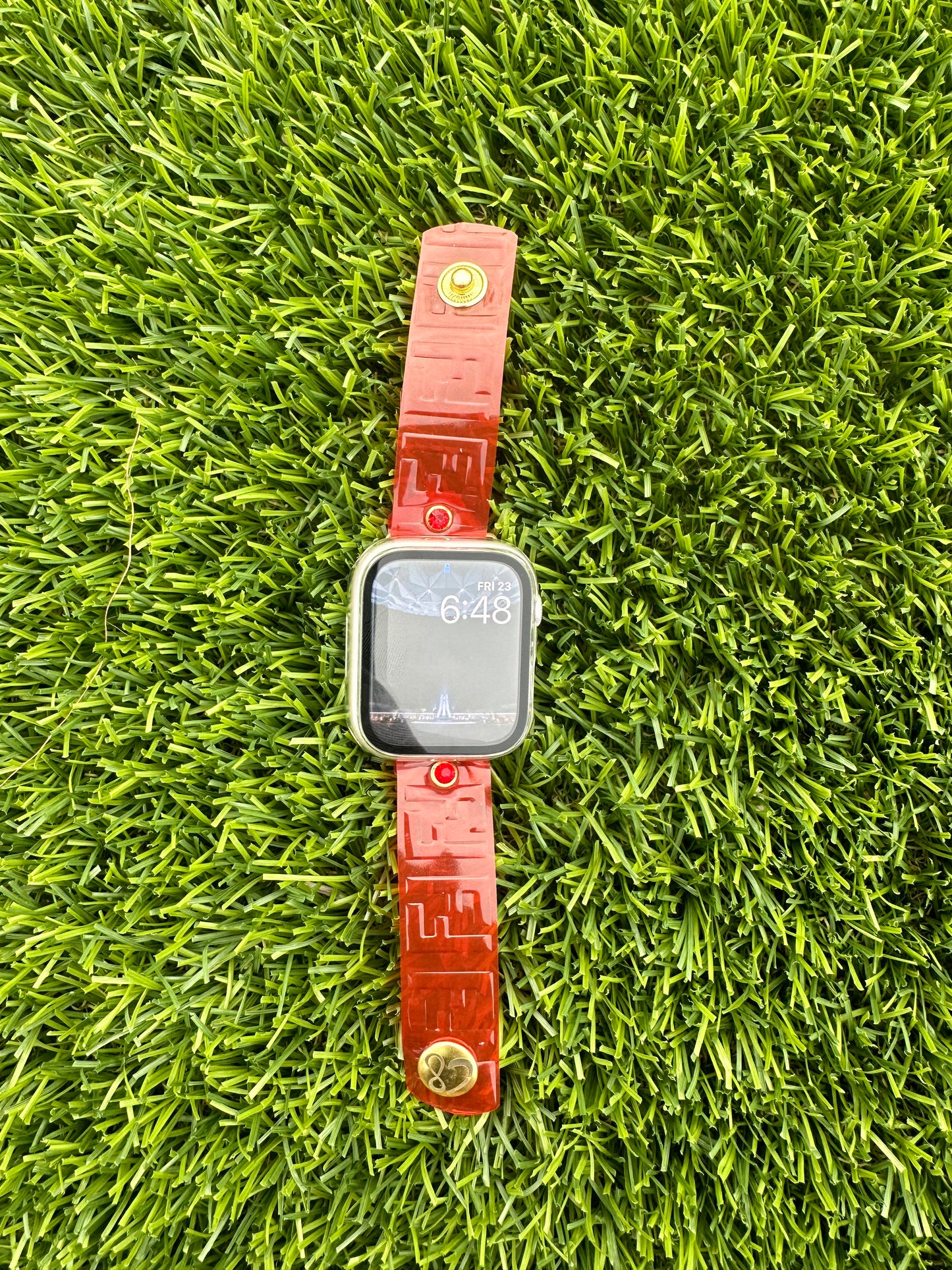 This is an authentic upcycled Red Fendi bag. It is a waterproof band made out of a red color plastic. It is paired with either silver or yellow gold rimmed crystals and matching hardware. Pair it with the color crystal of your choice. Available in all of our styles.