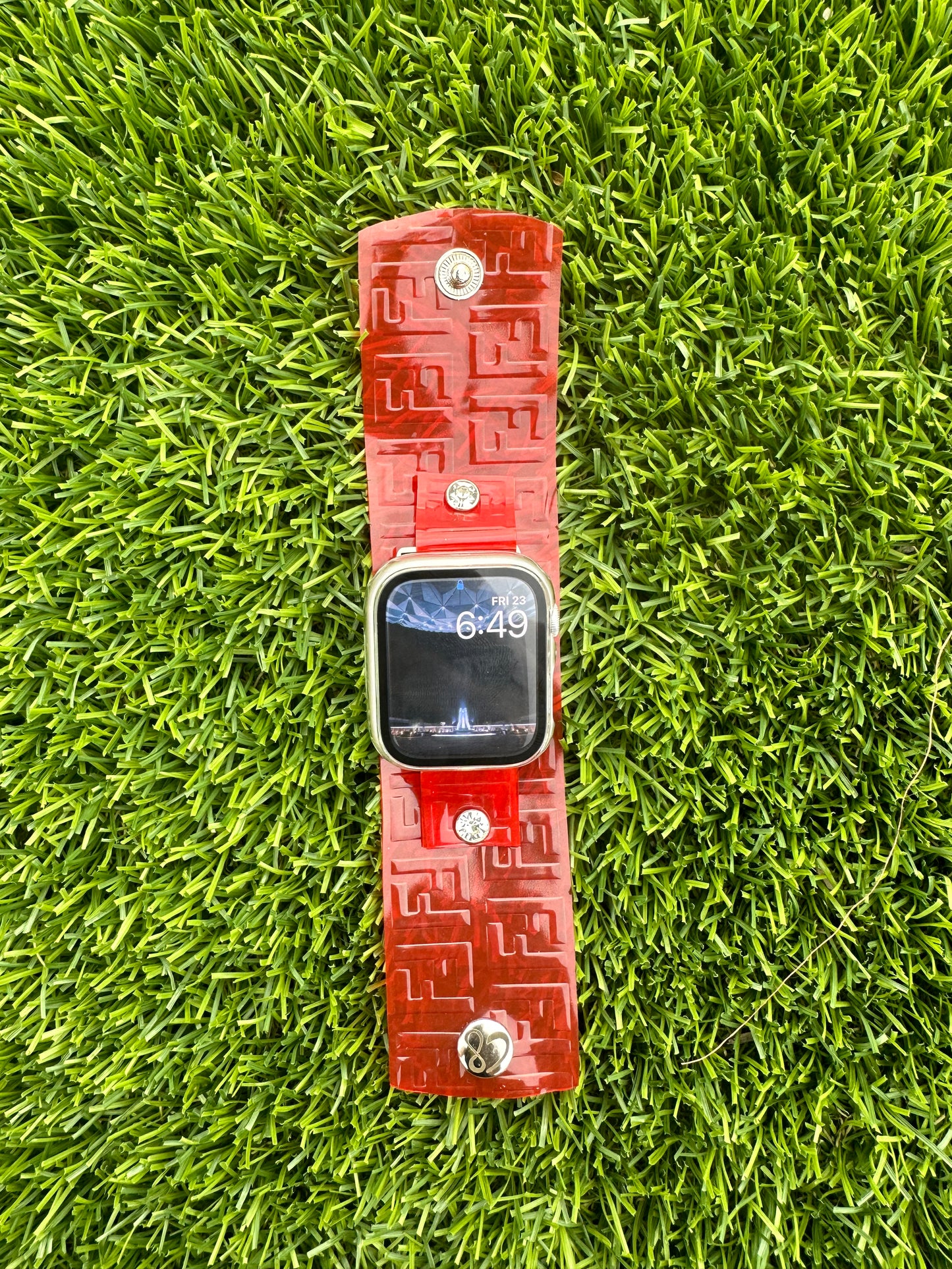 This is an authentic upcycled Red Fendi bag. It is a waterproof band made out of a red color plastic. It is paired with either silver or yellow gold rimmed crystals and matching hardware. Pair it with the color crystal of your choice. Available in all of our styles.