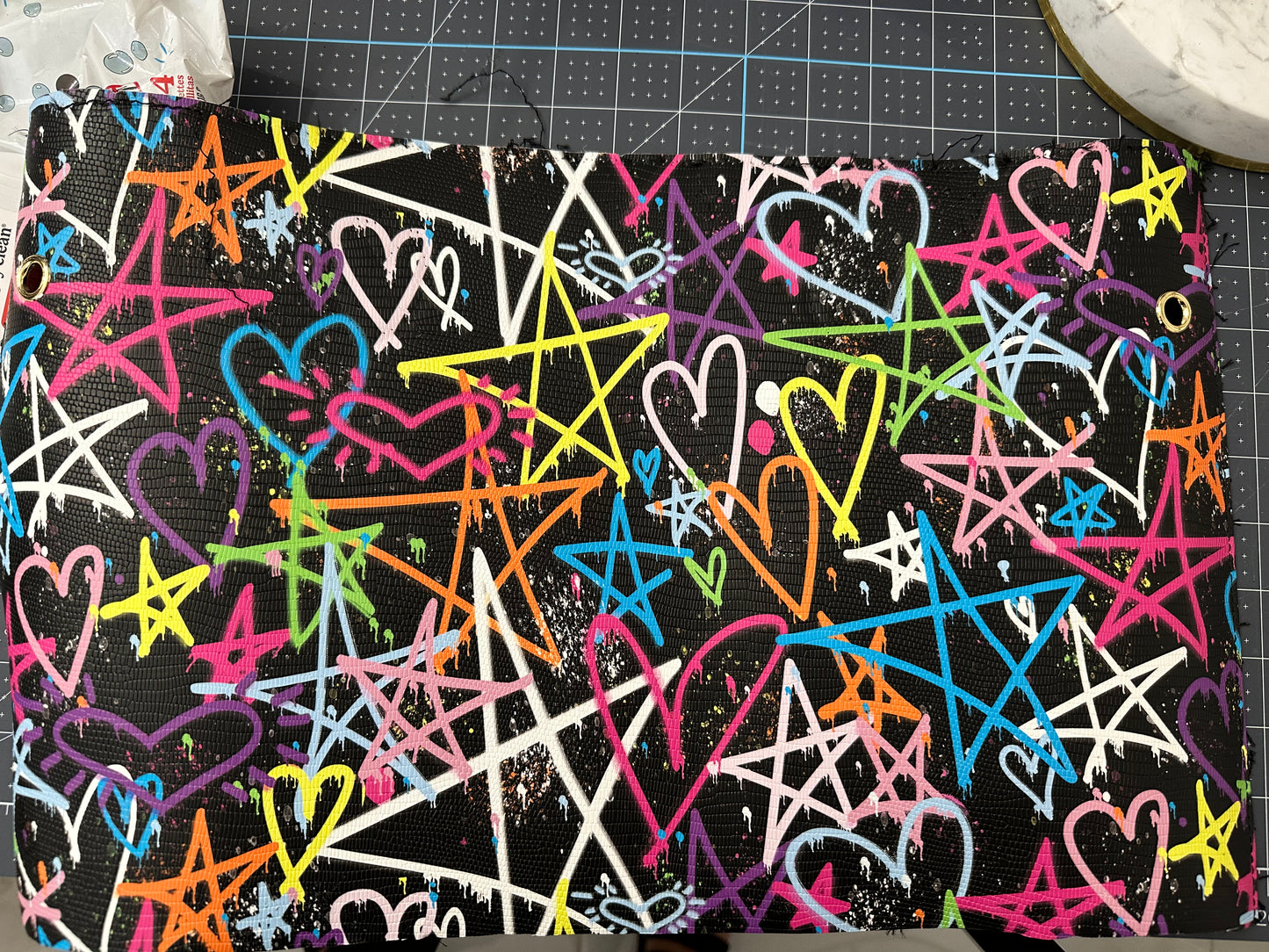 This is an authentic Besty Johnson band. It is made out of a faux leather material and lined with your choice of neon leather.