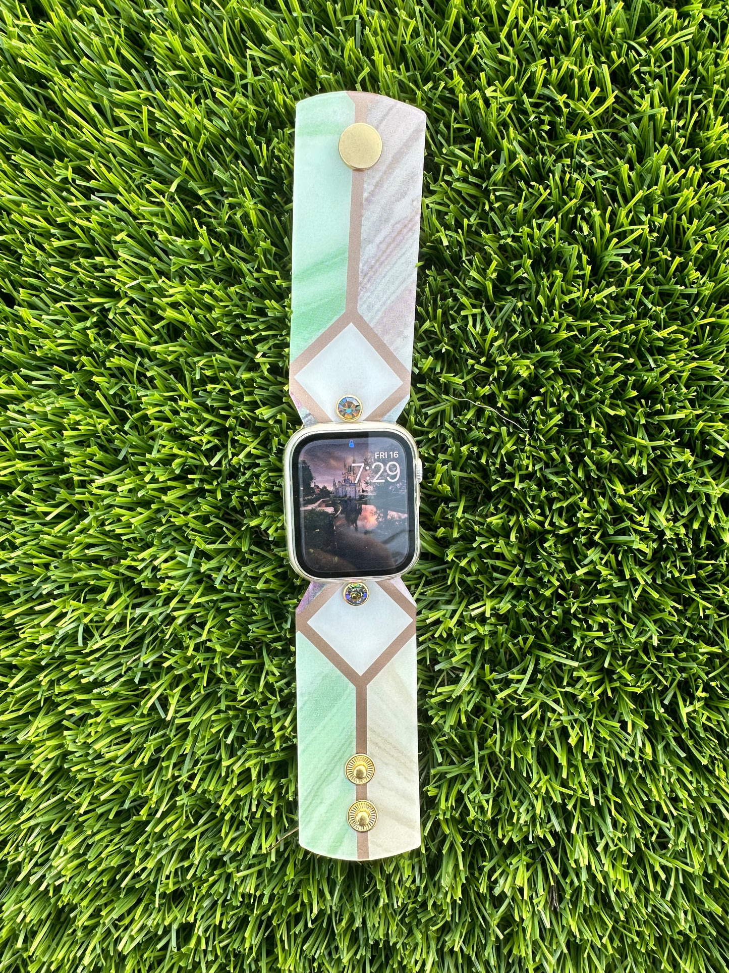 The Stained Glass band is made from an upcycled waterproof material. This band is paired with a gold rimmed crystal that will match the colors on each band. 